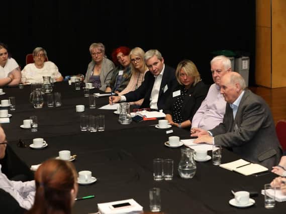 Alex Brazier (fourth from right) hosts the roundtable in Corby yesterday
