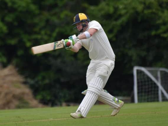 Greig Hofbauer hits out on his way to an unbeaten 114 during Finedon Dolben's win at Horton House. Pictures by Dave Ikin