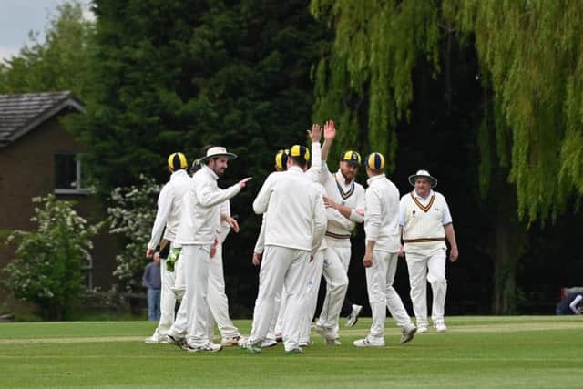 Finedon Dolben celebrate a wicket during their success at Horton House in the Premier Division