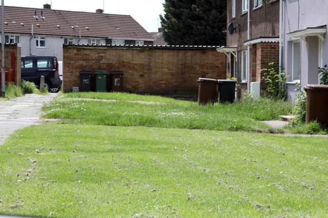 One neighbour has had their grass cut while another hasn't on the Beanfield estate.