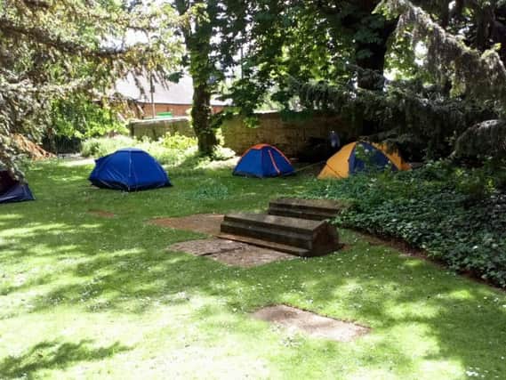 The number of tents in the grounds of St Peter and St Paul's church has increased in recent weeks.