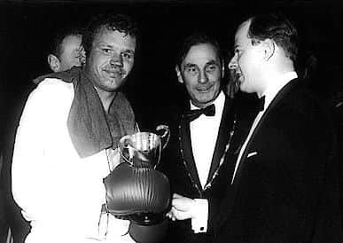 Dave (left) being presented with his 1969 ABA middleweight trophy by the Duke of Fife, watched by Len Mills, chairman of the Amateur Boxing Association. NNL-190528-114719005 NNL-190528-114719005