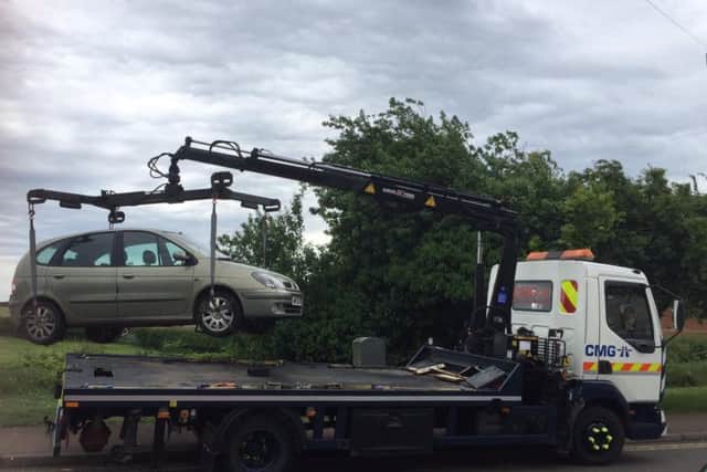 A Renault is lifted on to a lorry after police found it to be untaxed