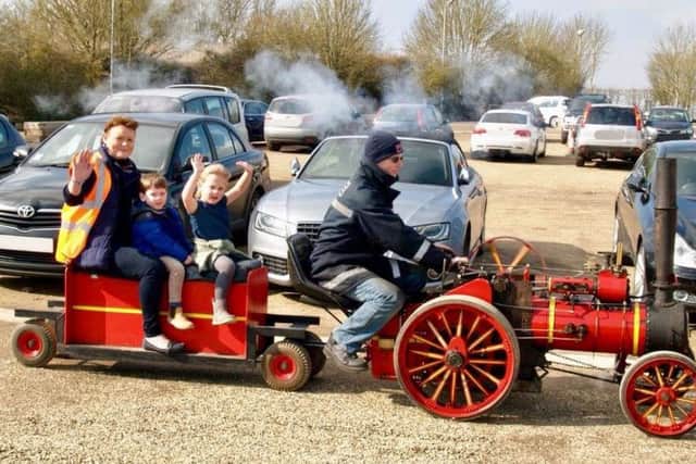 Exhibition manager Jackie Kneeshaw with her grandchildren enjoying the 4inch scale traction engine ride.