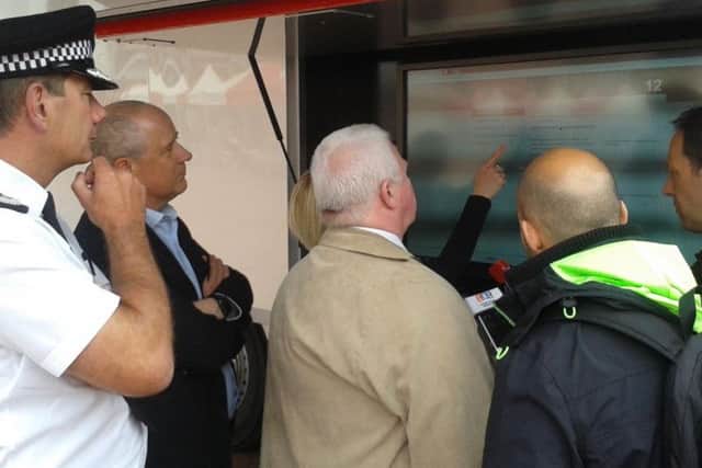 Chief Constable Nick Adderley (left) and police commissioner Stephen Mold (second left) observe the consultation in Northampton Market Square