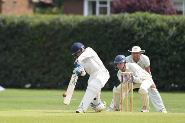 Tashwin Lukas in action with the bat for Brigstock. He later took five wickets but couldn't prevent a loss to Old Northamptonians