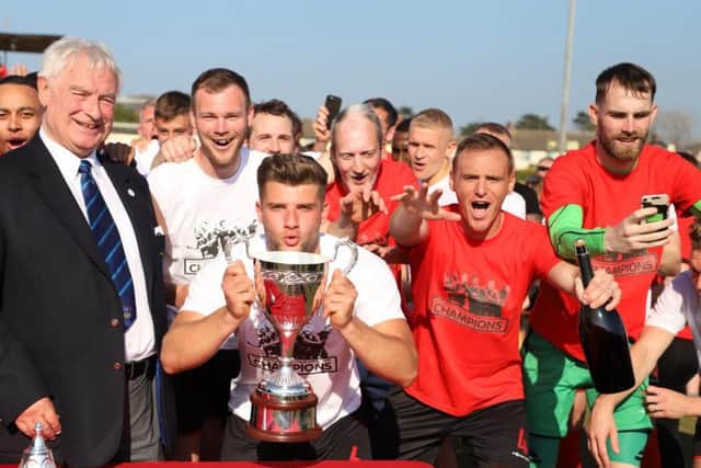 Kettering Town captain Michael Richens lifted the Evo-Stik League South Premier Division Central title last season and he has now penned a new two-year deal with the club. Picture by Peter Short