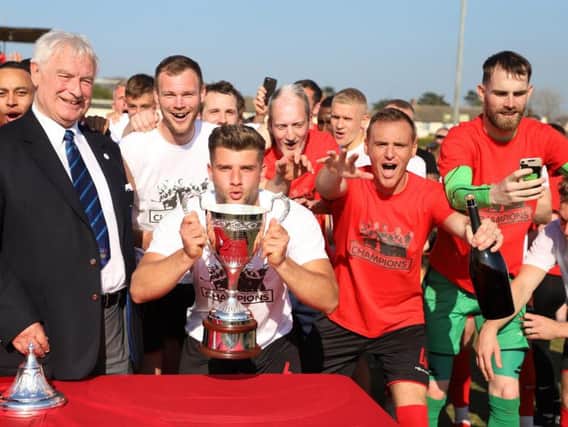 Kettering Town captain Michael Richens lifted the Evo-Stik League South Premier Division Central title last season and he has now penned a new two-year deal with the club. Picture by Peter Short