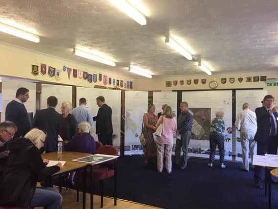 Residents at the exhibition held at the Higham Ferrers Bowls Club yesterday.