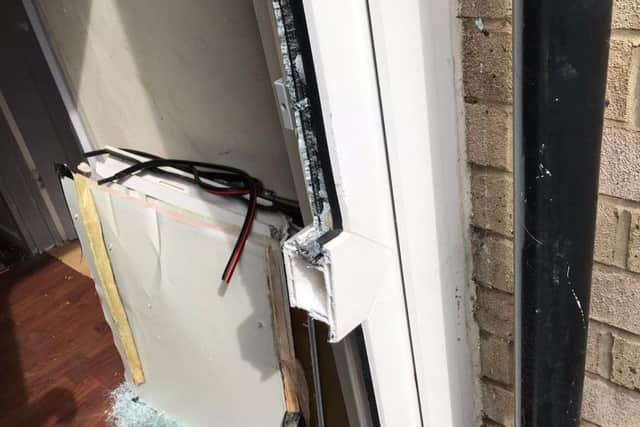 The door to the property was smashed through by police officers
