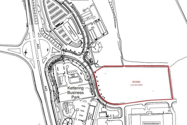 The earmarked site is outlined in red, with the police building and hamburger roundabout to the west.