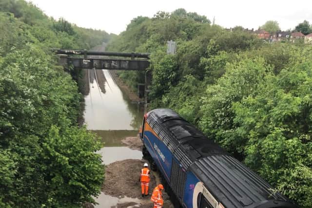 The bank collapsed into the side of this train. There is still flooding on the line.