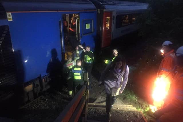 Passengers being freed from the train. Picture by Mark Waldron.