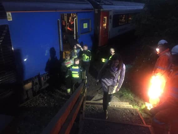 Passengers being freed from the train. Picture by Mark Waldron.