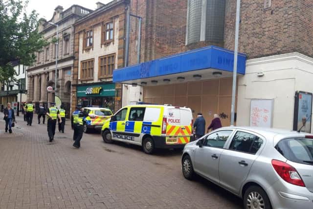 Officers surrounded the front of the bingo hall as teams broke into the back of the property.