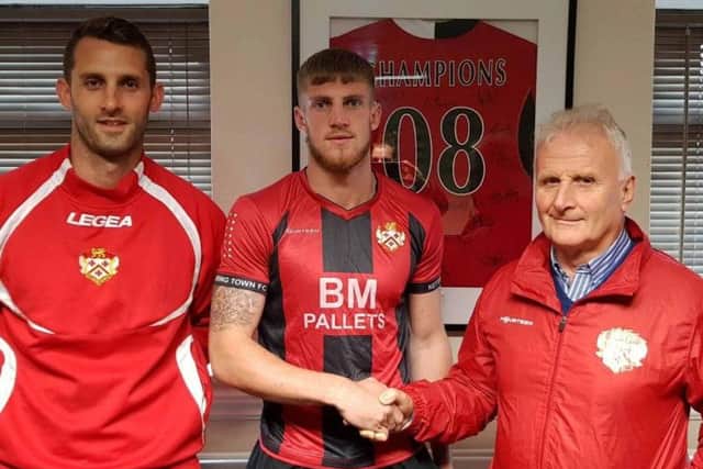 Connor Kennedy is welcomed to Kettering Town after making the switch from Corby Town by Luke Graham (left) and technical director Alan Doyle. Picture courtesy of Kettering Town FC