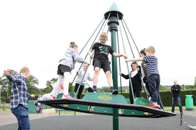 Children enjoy the new ride.