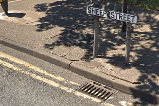 A woman was pushed and robbed of her handbag in Sheep Street.