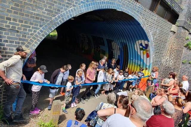 The mural officially opens.