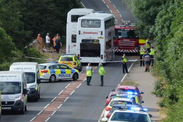 Emergency services at the scene last year. Picture by Andrew Carpenter.