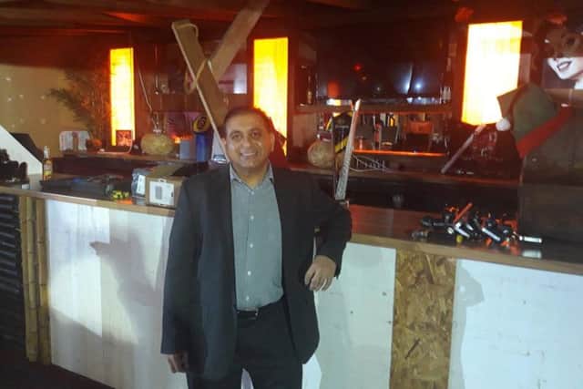 Owner Sanjai Tailor in the bar, where work is progressing.