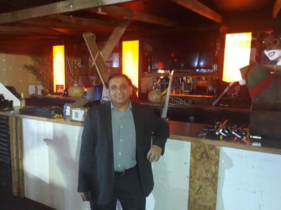 Owner Sanjai Tailor in the bar, where work is progressing.