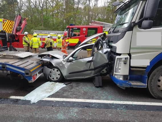 The car was crushed between two lorries on the M1 near Northampton. Photo: Northamptonshire Police