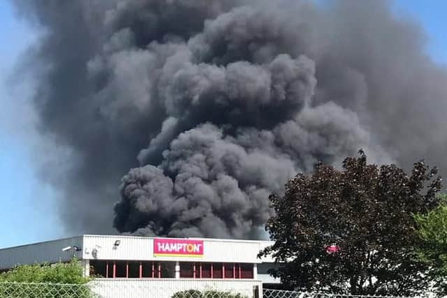 Thick black smoke can be seen across the area. This picture was taken by Mark Matthews in Sanders Road.