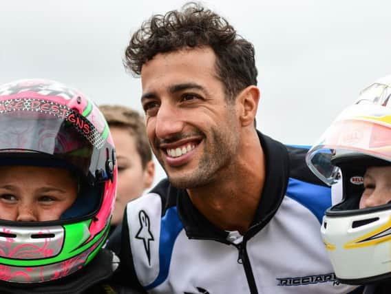 Formula 1 driver Daniel Ricciardo with two young racers at Whilton Mill karting track near Daventry. Photo: James Fitchew Photography