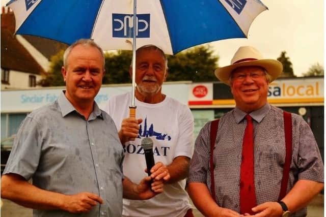 Leader of Wellingborough Council, Martin Griffiths, Chairman of Bozeat Parish Council, Brian Gibbins and Deputy Leader of the Council, Tom Partridge-Underwood at Bozeat Fete, following the handing over of a £1 for the transfer of the village green.
Saturday 6th July 2019 NNL-190907-145929005