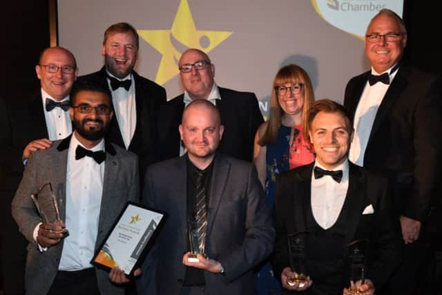 Parm Bhangal, Allen Tew and Nathan Taylor-Allkins with their awards and the awards sponsors.