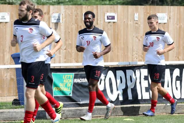 New signing Daniel Nti warms up with his Kettering Town team-mates