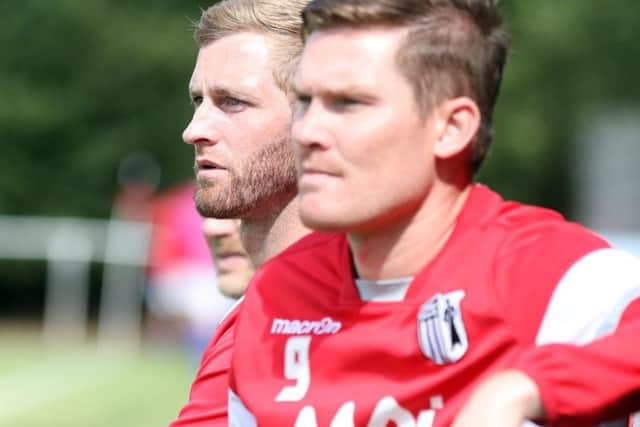 Corby Town joint-manager Gary Mulligan and assistant-boss Elliot Sandy watch on during their team's 3-1 defeat at Rothwell Corinthians. Pictures by Alison Bagley