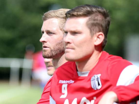 Corby Town joint-manager Gary Mulligan and assistant-boss Elliot Sandy watch on during their team's 3-1 defeat at Rothwell Corinthians. Pictures by Alison Bagley