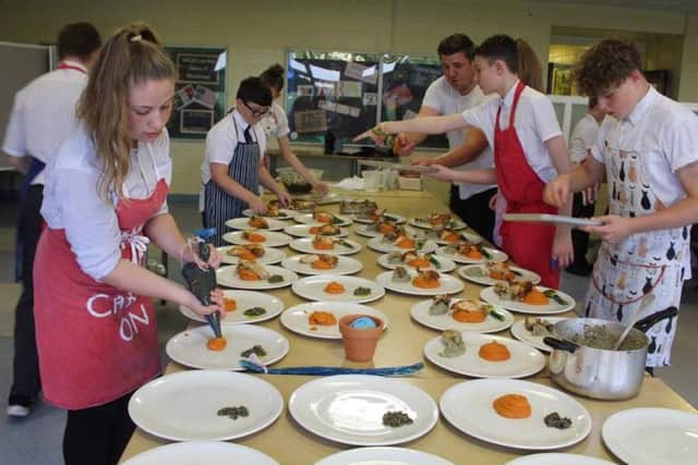 Students help prepare the feast.