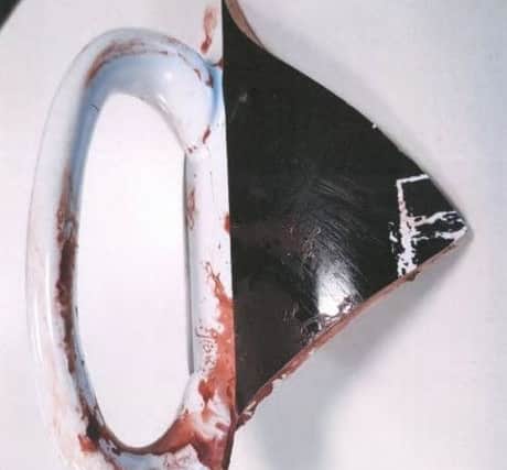 The smashed mug handle that was used as a weapon against Mr Brittin NNL-190725-142747005