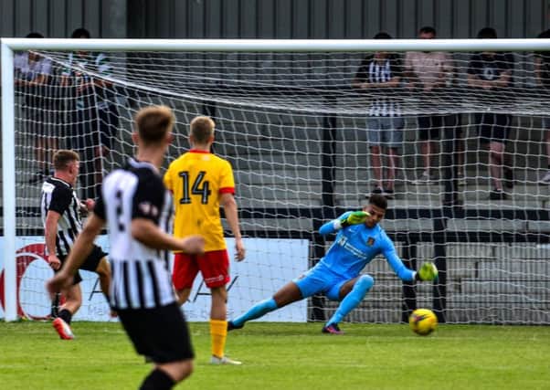 Jordon Crawford opened the scoring with this effort as Corby Town beat a Northampton Town XI in a pre-season friendly at Steel Park last week. Picture by Jim Darrah