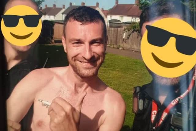 Andrew Fox in handcuffs after being arrested by police, who hid their faces behind emojis. Photo: Northamptonshire Police/Twitter
