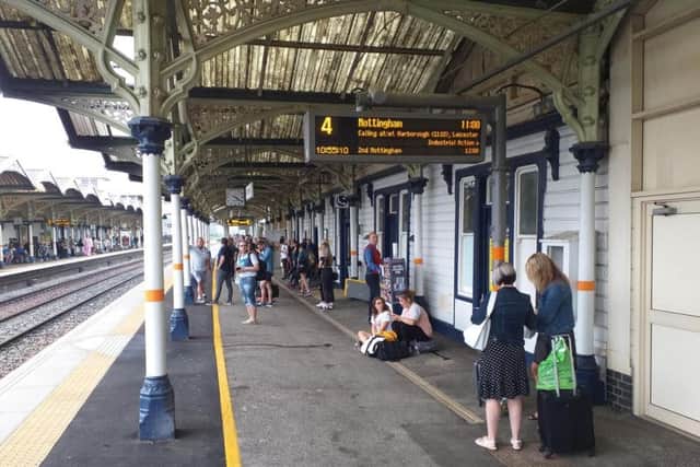 Passengers at Kettering station this morning. Picture by David Fursdon.