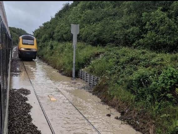 This picture by Will Hargrave shows the flooded line last month. It caused hundreds of passengers to be stranded.