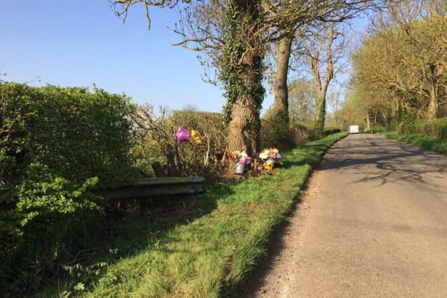 Flowers at the scene of the crash.