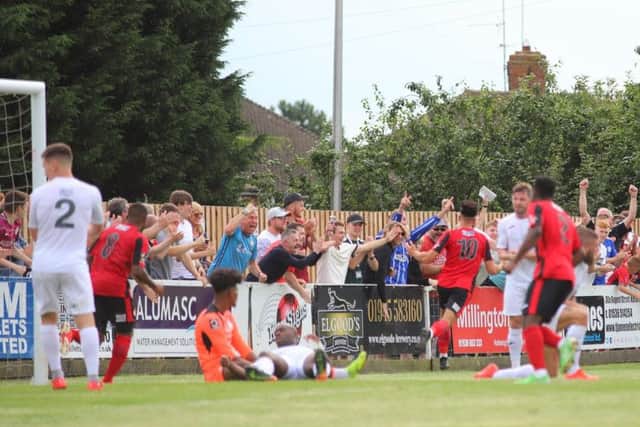 Joel Carta heads off to celebrate after scoring Kettering Town's first goal in their 2-1 victory over AFC Telford United. Pictures by Peter Short