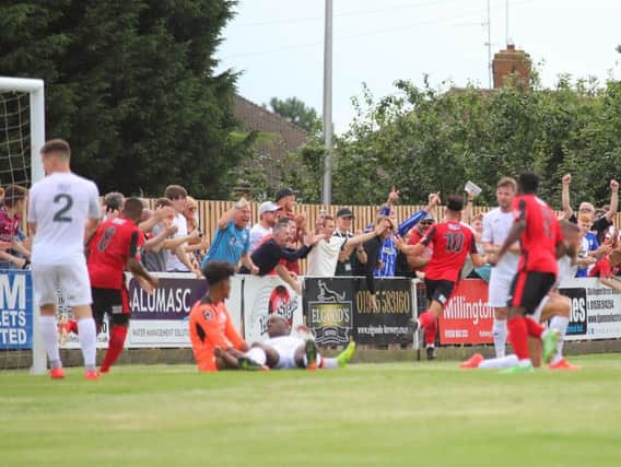 Joel Carta heads off to celebrate after scoring Kettering Town's first goal in their 2-1 victory over AFC Telford United. Pictures by Peter Short