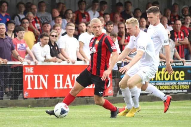 Lindon Meikle gets on the ball for the Poppies