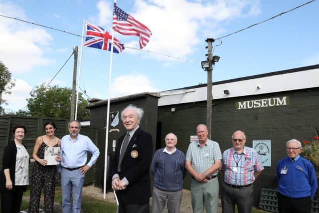 Eugene with family members and Harrington Aviation Museum Society members.