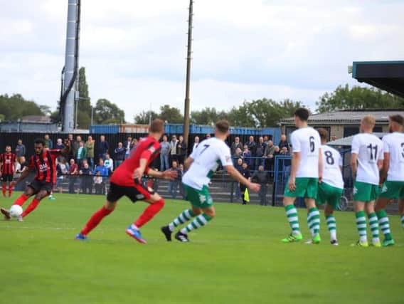 Dan Nti tries his luck with a free-kick for Kettering Town