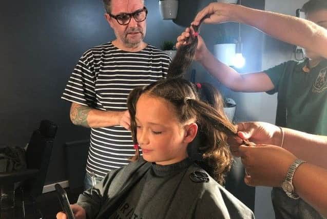 Rousso in the chair at Christian Wiles' salon
