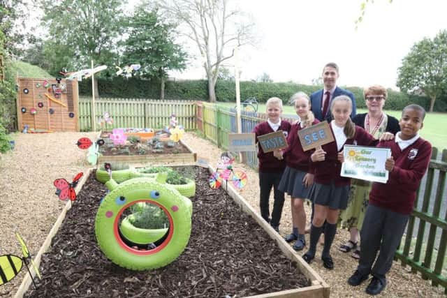 Mr Simon Anderson and Mrs Sara Croot with some of the Year 5 pupils.