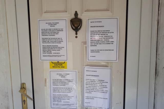 Notices have been placed on the door to tell patients what action to take