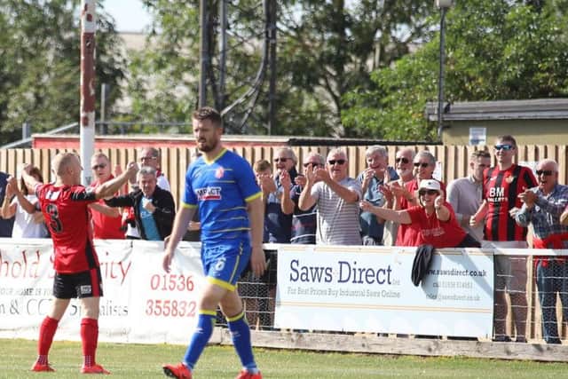 Marcus Kelly celebrates in front of the Kettering Town fans after he scored their second goal in the 2-1 win over Alfreton Town. Pictures by Peter Short